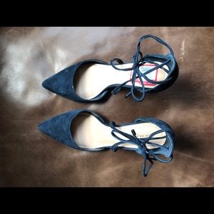 Navy suede ankle lace pumps.
